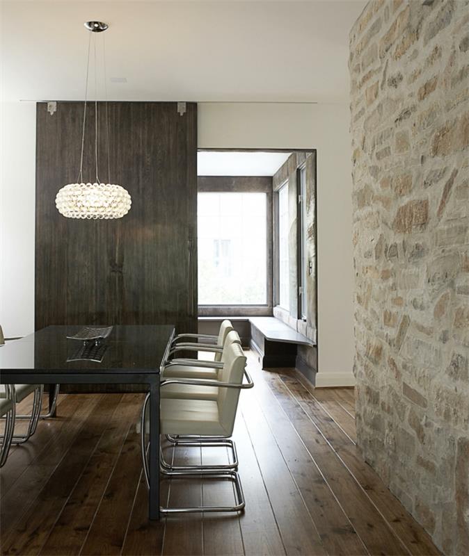 σχεδιασμός τοίχου τραπεζαρία πέτρινος τοίχος ξύλινο πάτωμα μοντέρνος πολυέλαιος