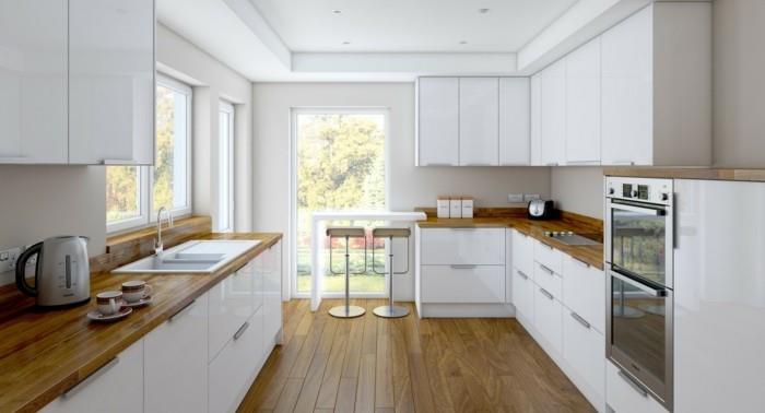 λευκή κουζίνα με ξύλινο πάτωμα και ξύλινη επιφάνεια εργασίας