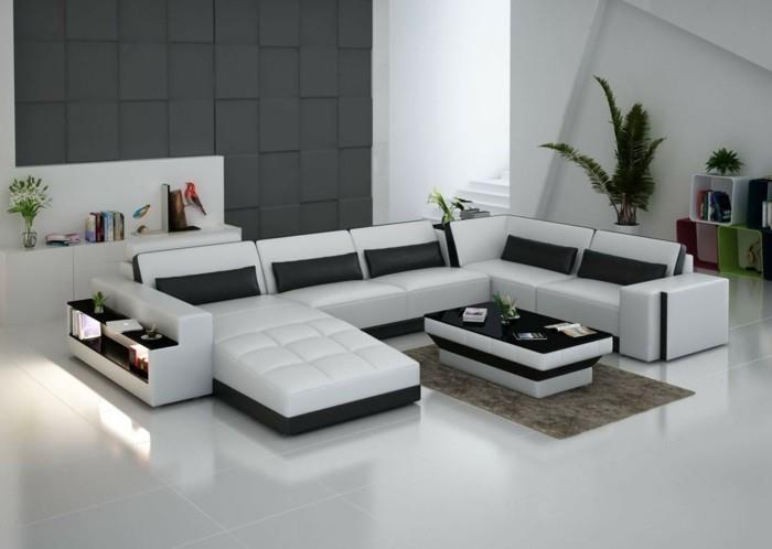 λευκός καναπές σχεδιαστών με μαύρα διακοσμητικά μαξιλάρια