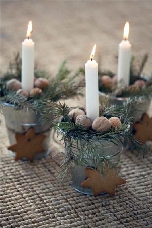 Χριστουγεννιάτικες ιδέες διακόσμησης τραπεζιού κεριά καρυδιά κλαδιά φυσική διακόσμηση