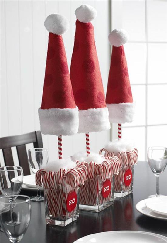 Χριστουγεννιάτικες ιδέες διακόσμησης τραπεζιού καραμέλες καπέλα κόκκινα καπέλα Άγιου Βασίλη