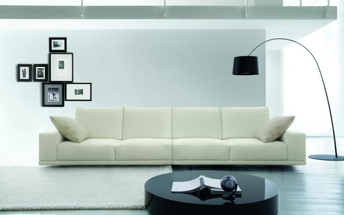 διακόσμηση τοίχου σαλονιού διακοσμητικό λευκό καναπέ μαύρο τραπεζάκι σαλονιού